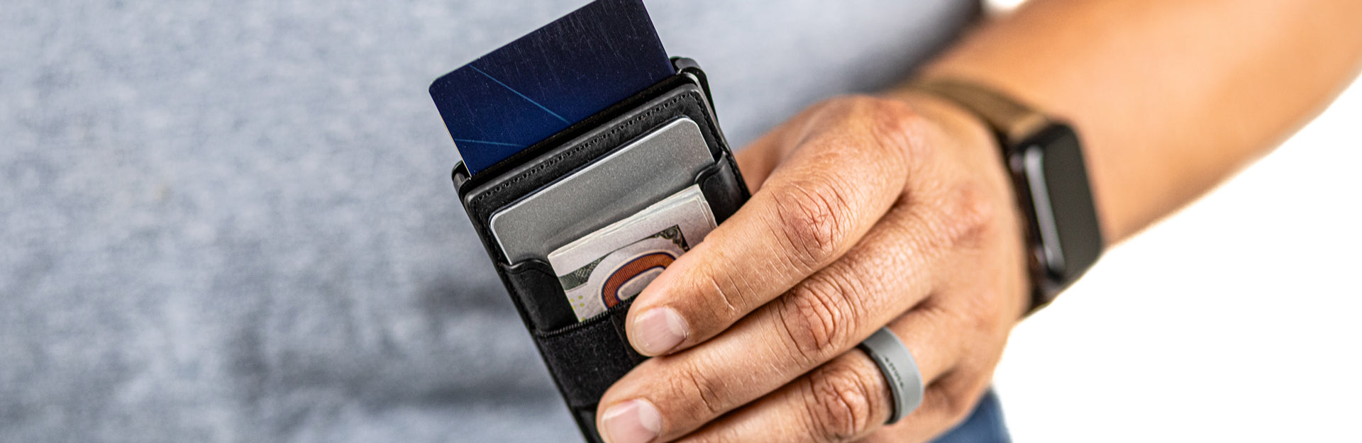 man holding groove wallet