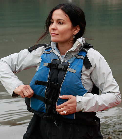 woman wearing a life vest also featuring a Groove Life ring on her hand