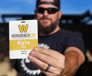 Kyle Worley holds up his Workbench Con pass