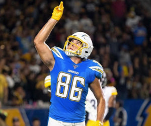Hunter Henry points to the sky in his Chargers jersey during a game